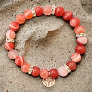 Custom Orange Tigers Eye glass beaded stretch bracelet with Seashell charm